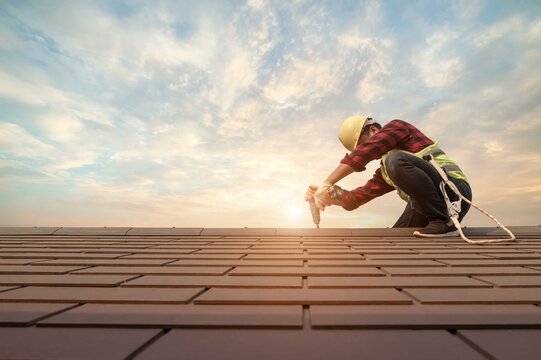 Roofing contractors in Wilmington NC performing residential roof replacement with quality materials.